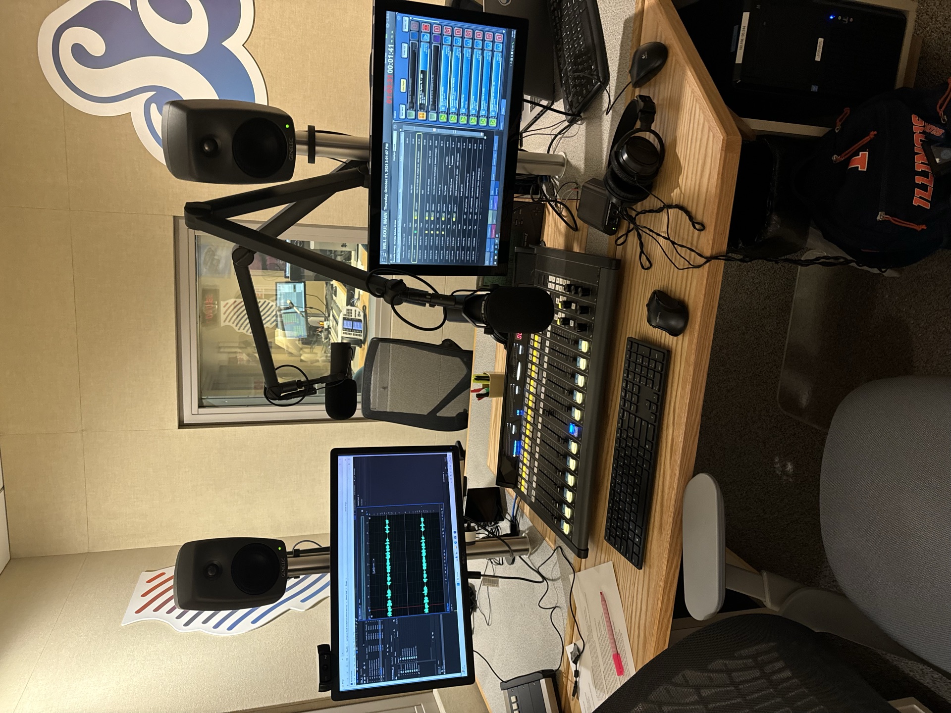 Broadcast production studio with audio equipment and microphones